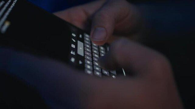 Close-Up Of Hands Typing Text Message On Smartphone