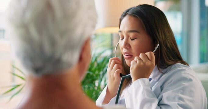 Stethoscope, listen and doctor with senior patient for medical service, consulting and diagnosis. Healthcare, retirement and woman with elderly person for cardiology, checkup and medicare in home