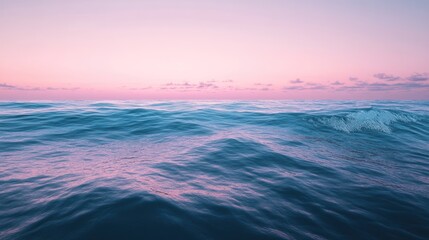 Fototapeta premium Serene seascape featuring gentle waves bathed in pastel hues of dawn or dusk