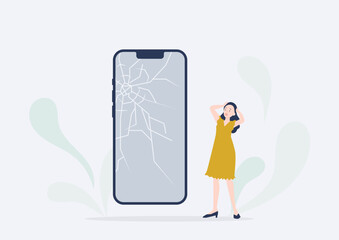 スマホの画面がバキバキに割れてショックを受ける若い女性