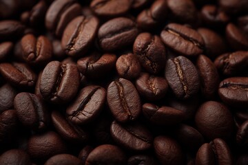 Fototapeta premium Aromatic pile of roasted coffee beans, close-up of natural energetic ingredients