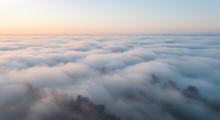 Obraz premium Majestic Aerial View Of Foggy Cloudscape With Morning Light Landscape