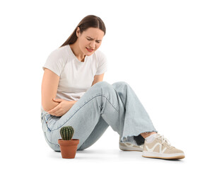 Young woman with cactus on white background. Cystitis concept
