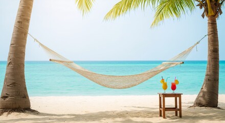 Tropical beach paradise with hammock between palm trees, turquoise ocean view, and refreshing cocktails. Summer vacation relaxation concept for travel and leisure advertising