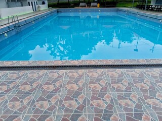 Swimming Pool with Blue Water and Tiled Surround