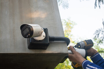 Technician installing CCTV camera system for security area