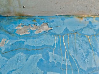 Damaged Blue Wall with Peeling Paint and Water Stains Texture