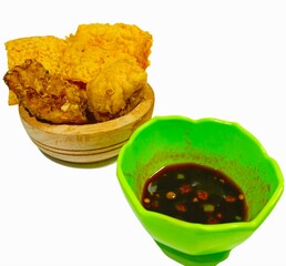 Serving of Fried Food with Dipping Sauce on White