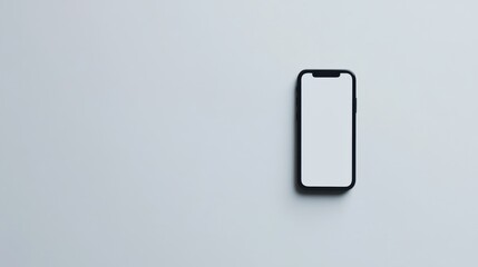 Minimalist Smartphone on Light Grey Surface with Blank Screen for Mockup and Design Use