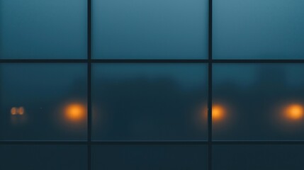 A frosted glass window with soft, blurred yellow lights glowing behind it in a grid pattern at night.