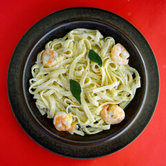 Garlic prawn fettuccini on a plate.