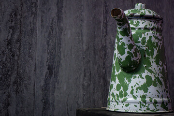 Antique Enamel Teapot with Classic Design and Detailed Texture
