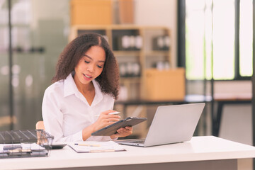 Fototapeta premium African American young woman working with laptop. Working lifestyle and confidence. Diversity and business success banner.