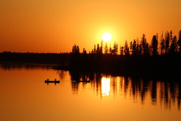 Naklejka premium Boats On The Sunset