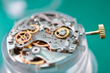 Intricate wristwatch mechanism revealed through macro photography capturing gears and springs at...