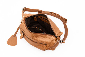 Women's brown matte leather shoulder bag open, blank bag isolated on white background.