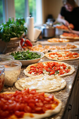  A busy kitchen with the sound of chopping and stirring. A family is making homemade pizza with everyone adding their favorite toppings