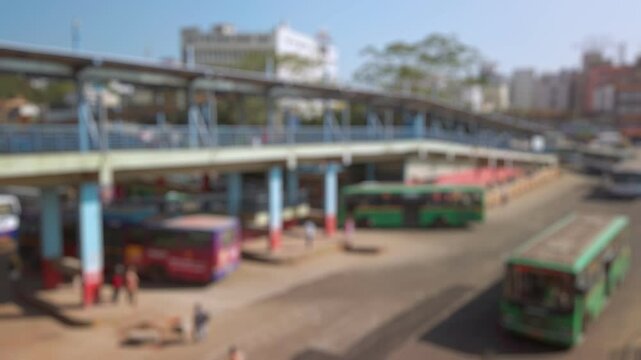 Bokeh view of Kempegowda Bus Station in sunny day, Bangalore, India. Blurred background footage.