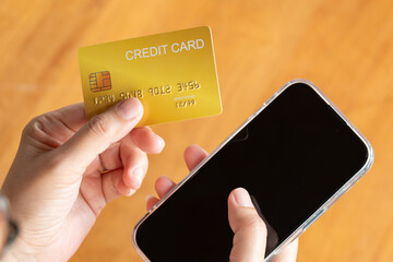 Woman holding several credit cards and he is choosing a credit card to pay and spend Payment for...
