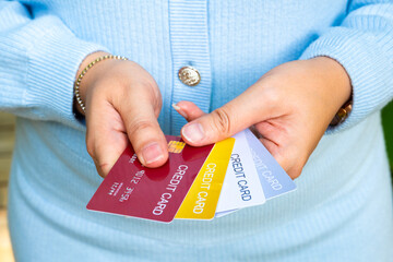 man holding credit cards and he is choosing a credit card to pay and spend Payment for goods via...