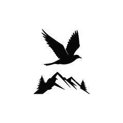 Silhouette of a soaring bird above mountain peaks representing nature and adventure
