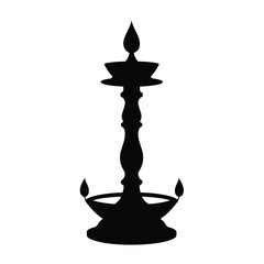 Black silhouette of a traditional indian lamp used in religious and cultural celebrations.