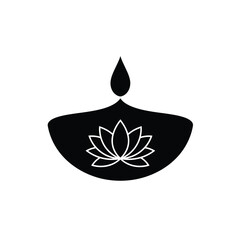 Elegant black and white diya oil lamp with lotus flower symbol for spiritual design