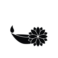 Black and white silhouette of a diwali diya oil lamp and a beautiful lotus flower decoration
