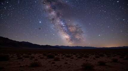 Fototapeta premium Stunning Night Sky Featuring Milky Way Galaxy Above Desert Landscape with Stars and Mountains in the Background