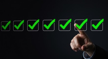 Fototapeta premium Hand selecting checkmark from a series of boxes with green check marks shown