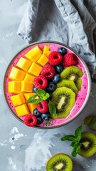Colorful Smoothie Bowls with Various Sliced Fresh Fruits in a Vibrant Top-Down Presentation