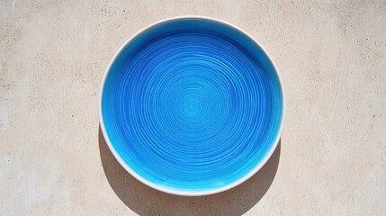 Vibrant blue circular plate ceramic texture concentric pattern food photography home decor