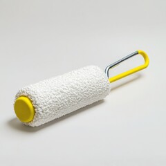 Paint roller with yellow handle on a white background