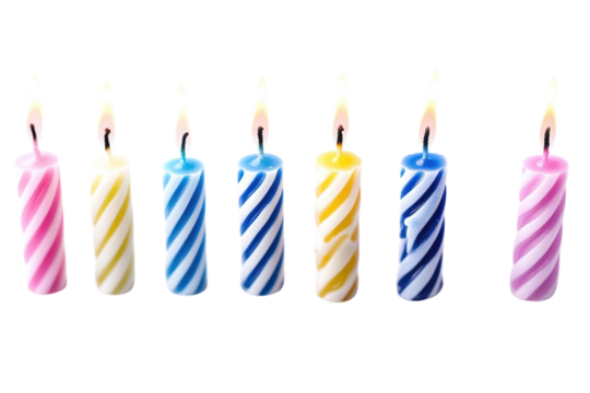 Seven brightly lit spiral birthday candles against a black background perfect for festive on transparent background