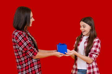 Mother and daughter. Gift for Mothers Day. Gift for mother. Birthday or Valentines Day for Mother. Womens Day. Surprise Mother with gift. Holiday with mom and child. Celebrate family event.