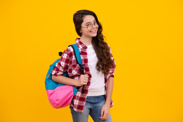 Schoolgirl with backpack. Teenager student, isolated background. Learning and knowledge. Go study. Children education concept. Back to school. Happy teenager, positive and smiling.
