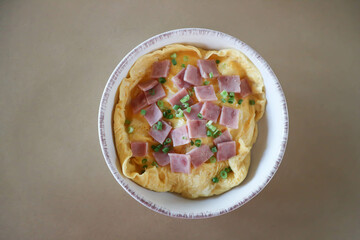 creamy omelet or omelet or omelette or fried egg with ham and green onion