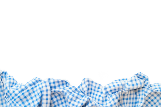 A crumpled blue and white checkered fabric against a stark black