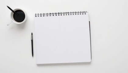 Blank Spiral Notebook, Coffee Cup, and Pen on White Desk. Minimalist Workspace Setup for Writing, Planning, or Note-Taking.