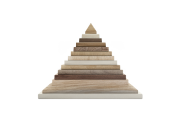 A pyramid made of wooden blocks of varying shades isolated against a black background