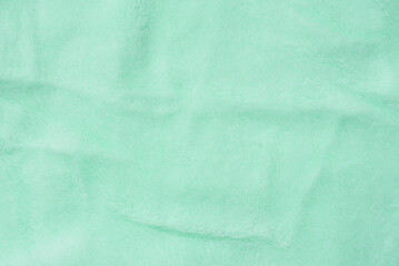 Texture of green velvet fabric
