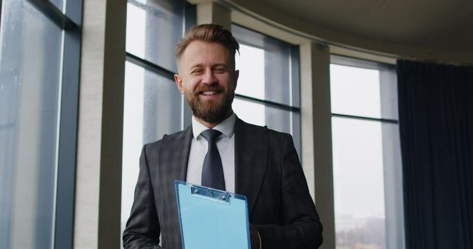 Portrait of a happy businessman, boss, chief or leader working in the office. Positive expression reflects professionalism, business leadership, and an inspiring attitude in a corporate setting.