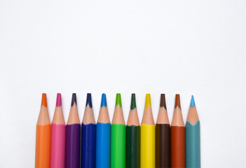 Vertical multicolored pencils aligned on clean white background. Great for banners, academic posters, and children&rsquo;s creativity promotion.