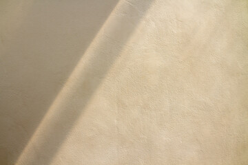 natural light and shadow drop on beige wall. abstract textured and background