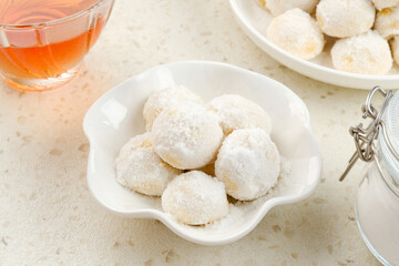 Kue Putri Salju or Snow White Cookies with round shaped. Made from flour, sugar and butter coated with powdered sugar. 