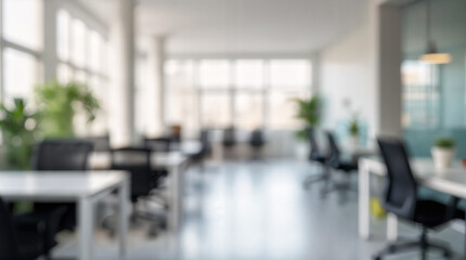 Blurred background of spacious minimalist coworking office featuring sleek white desks, black chairs, and abundant natural light, creating a productive and inspiring work environment.