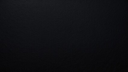 Close-up of natural black felt surface showcasing textured fabric. High-res photo.