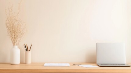 Minimalist workspace laptop notebook and dried flowers on desk