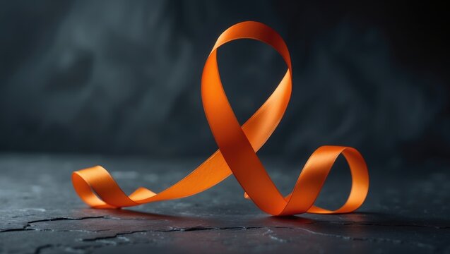 Kidney Cancer and Leukemia Awareness Symbolized by Orange Ribbon on Dark Background