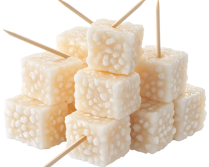 a group of cubes of food with toothpicks